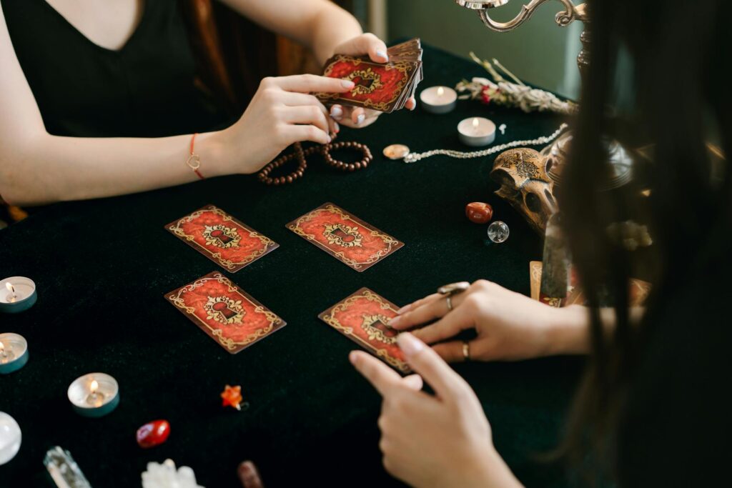 person holding a deck of tarot cards